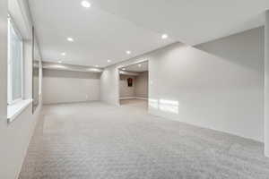 Empty room with light colored carpet