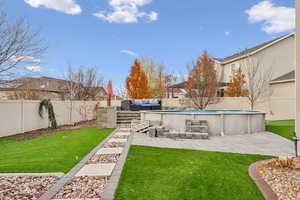 View of yard with a fenced in pool, a patio area, and an outdoor hangout area