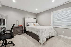 Bedroom with light carpet