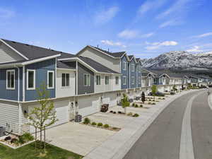 View of front of home with a mountain view and cooling unit