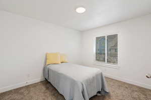 Bedroom featuring carpet flooring