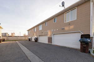 Rear view of property with a garage