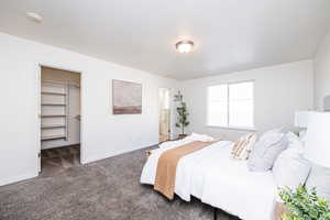 Bedroom with view of en-suite and large walk in closet.