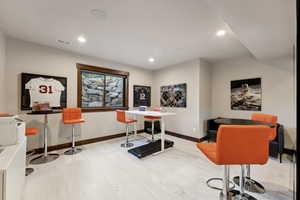 Office area with light wood-type flooring