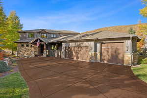 Prairie-style home featuring a garage