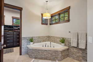 Bathroom with tiled bath