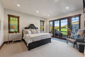 Carpeted bedroom featuring access to exterior