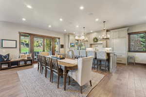 Dining area with light wood-type flooring