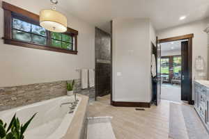 Bathroom with vanity and independent shower and bath