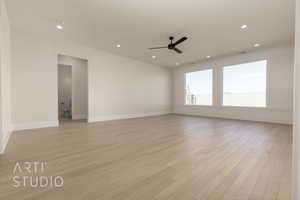 Unfurnished room with light hardwood / wood-style flooring and ceiling fan