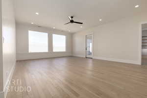 Unfurnished room with light hardwood / wood-style flooring and ceiling fan