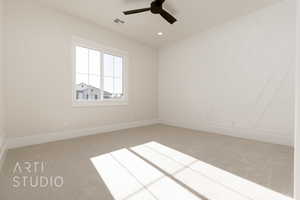 Carpeted spare room featuring ceiling fan