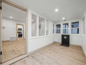 Empty room featuring light hardwood / wood-style flooring