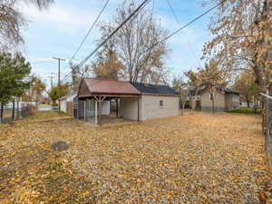 Back of property featuring an outbuilding