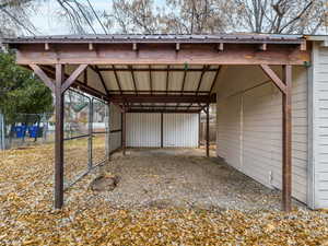 View of outdoor structure with a carport