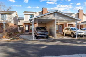 View of property with a carport