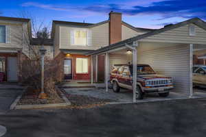 View of front of property with a carport