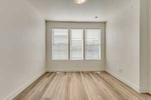 Empty room featuring light hardwood / wood-style flooring