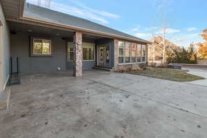 Rear view of property featuring a patio