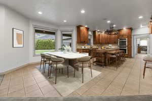 Virtual Staging: Dining area with light tile patterned floors, recessed lighting, and baseboards
