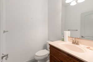 Bathroom featuring vanity and toilet