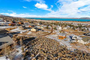 Birds eye view of property featuring a water and mountain view