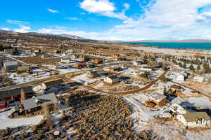 Birds eye view of property featuring a water and mountain view