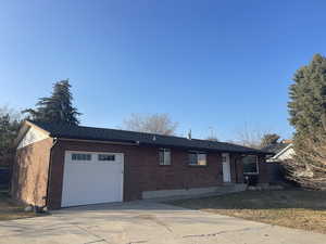 Ranch-style house featuring a garage