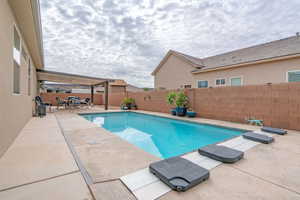 View of swimming pool with a patio area