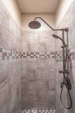 Bathroom featuring tiled shower