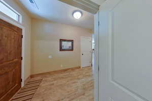 Entrance foyer with light hardwood / wood-style flooring