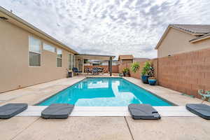 View of swimming pool with a patio