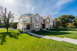 View of front of property with a front lawn