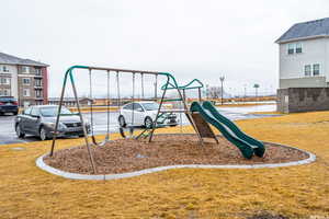 View of play area featuring a yard