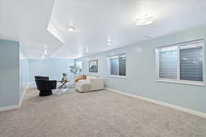 Unfurnished room with light colored carpet and a textured ceiling