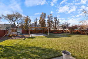 View of yard with a playground