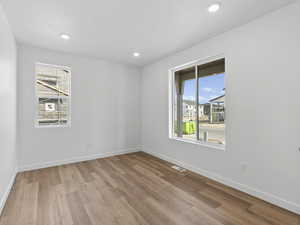 Spare room featuring light hardwood / wood-style floors