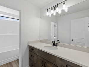 Bathroom with vanity and hardwood / wood-style flooring