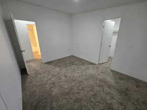 Unfurnished room featuring carpet