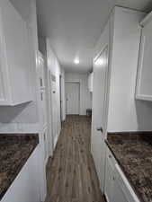 Hallway featuring wood-type flooring