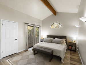 Bedroom featuring wood-type flooring, lofted ceiling with beams, and access to outside