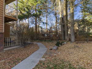 View of yard featuring a balcony