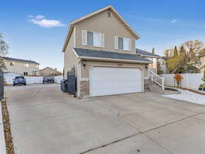 View of front of property featuring a garage adn XL RV parking