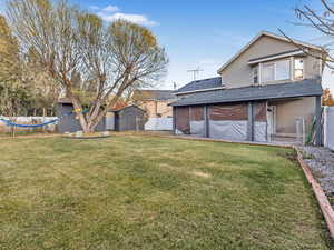 View of yard featuring a storage unit