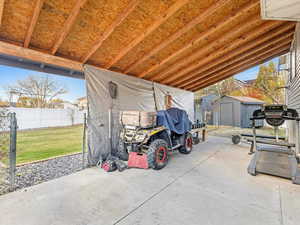 View of patio featuring a shed