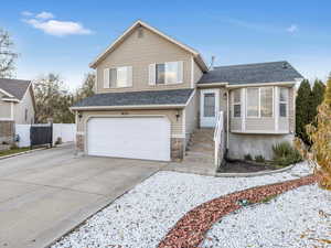 View of front of property with a garage