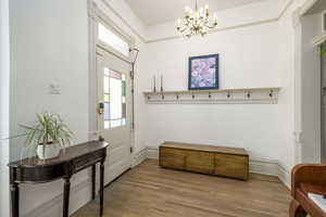 Interior space featuring hardwood / wood-style floors and an inviting chandelier