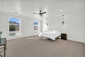 Bedroom featuring ceiling fan and light colored carpet