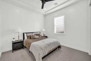 Bedroom featuring ceiling fan and light carpet