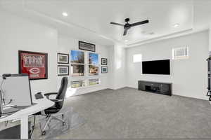 Office area featuring ceiling fan and light colored carpet